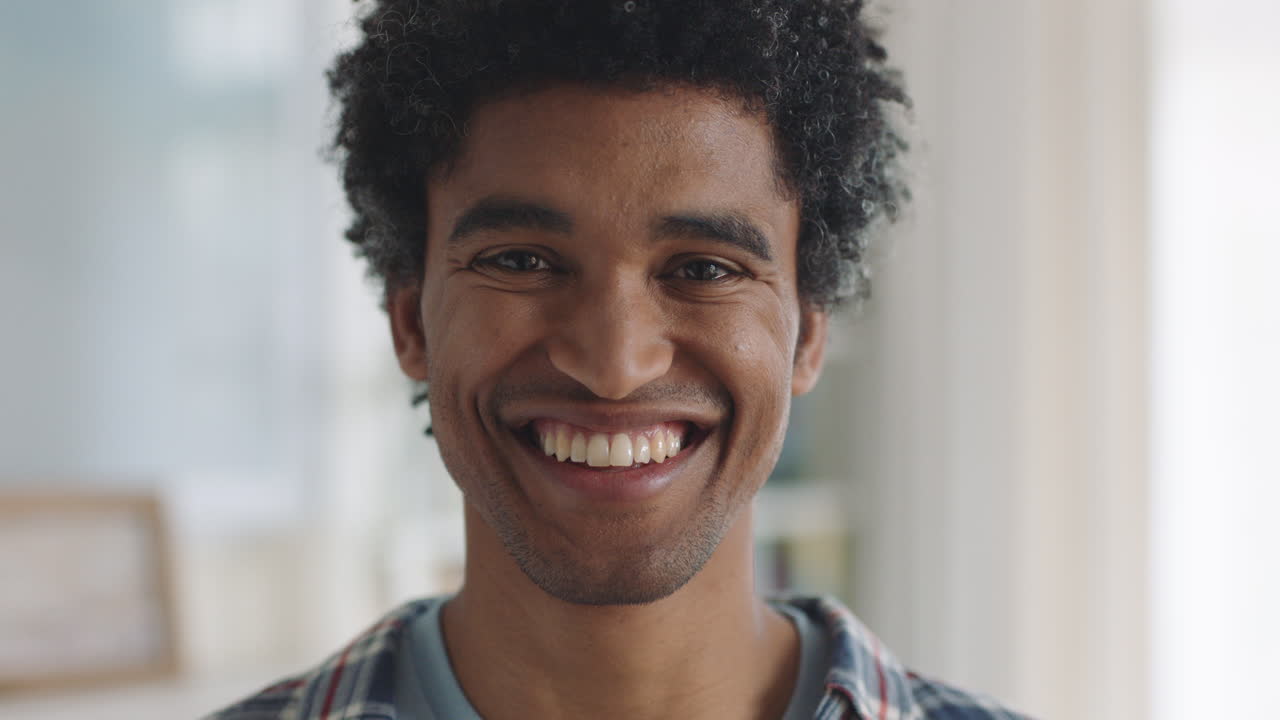 portrait happy mixed race man smiling enjoying successful lifestyle healthy man at home looking confident