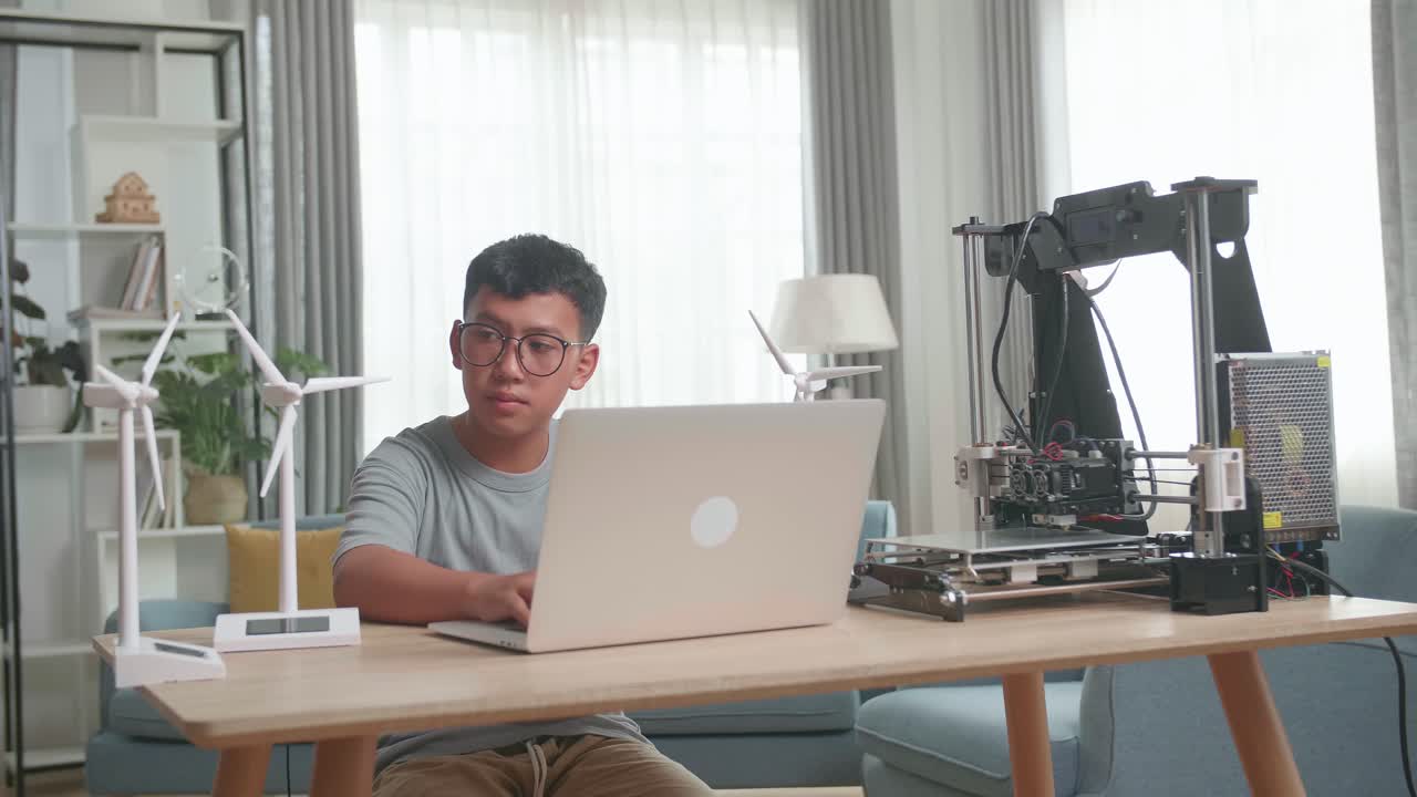 Boy Learning 3D Printing and Wind Turbine Models