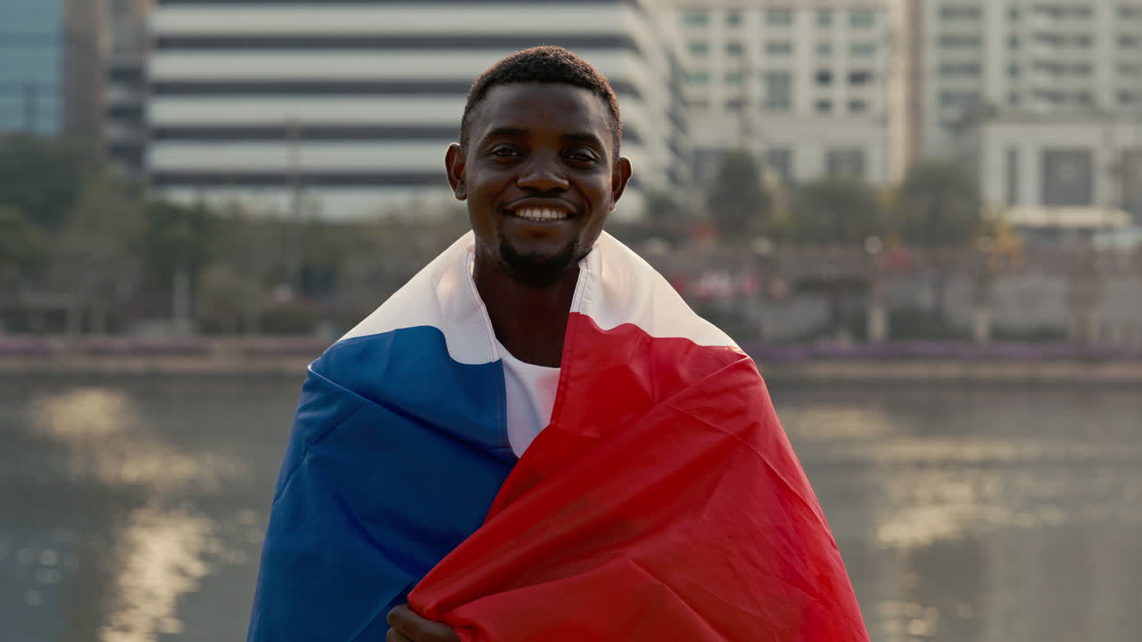 Smiling Man Wrapped in French Flag