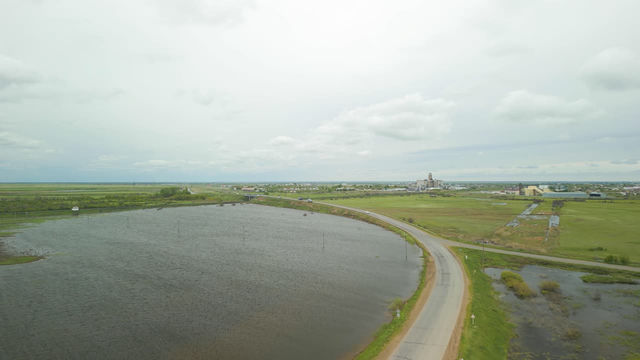 Aerial View of Flooded Road in Rural Landscape