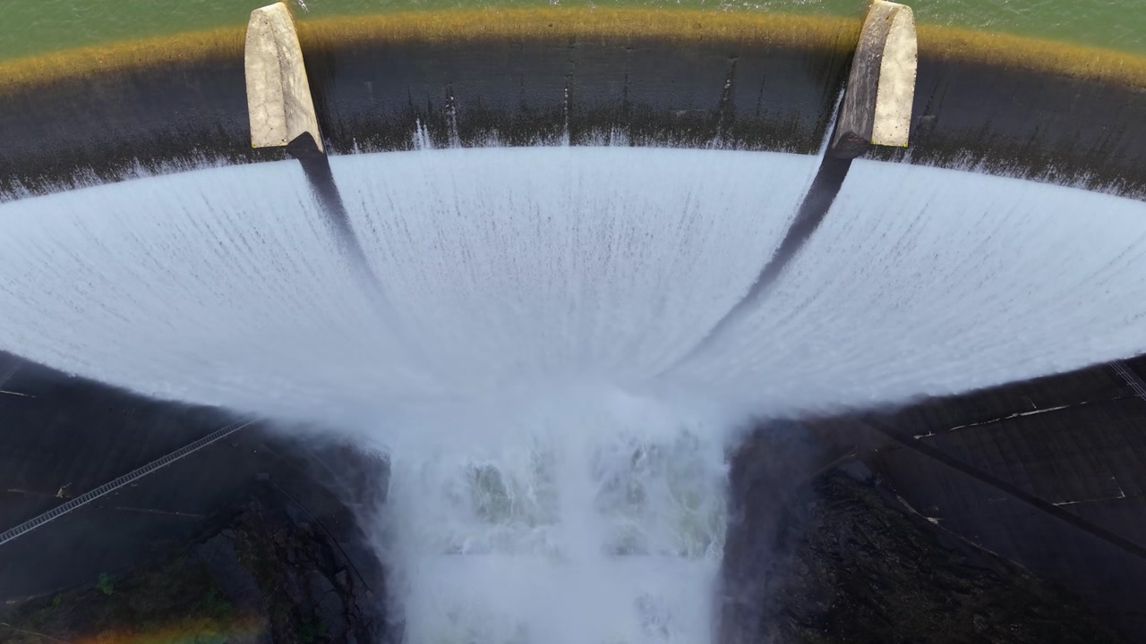 Breathtaking View Of Eume River Dam Spillways (Presa del Eume) In Galicia, Spain. Aerial Topdown Shot