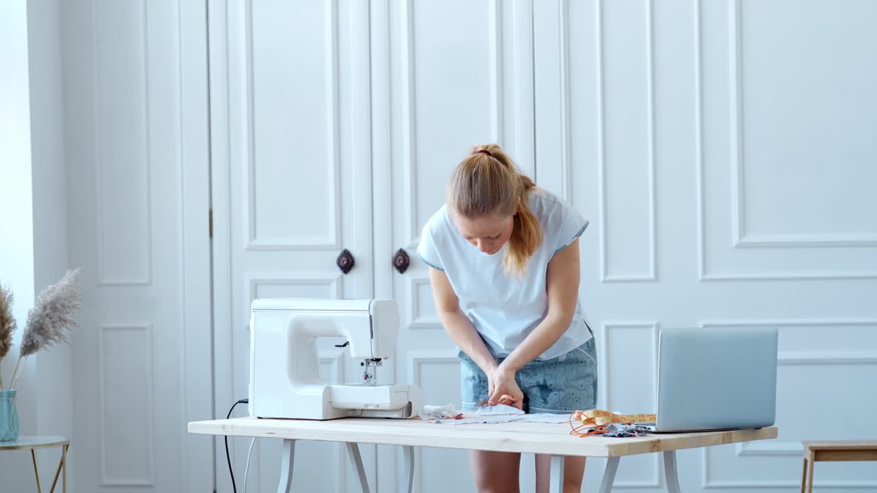 Woman sewing face masks at home