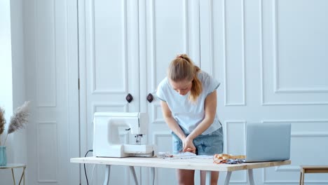woman sewing face masks at home