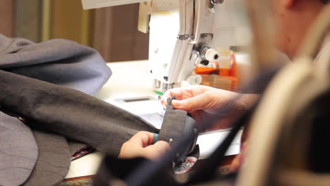 tailor working on a suit sleeve