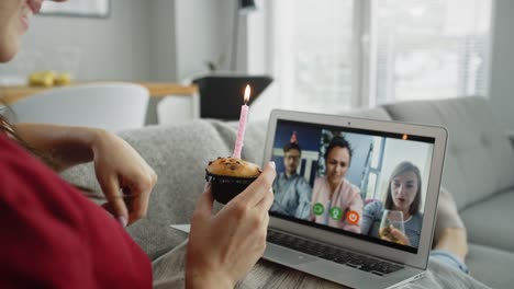 rear view of woman celebrates birthday with a video conference