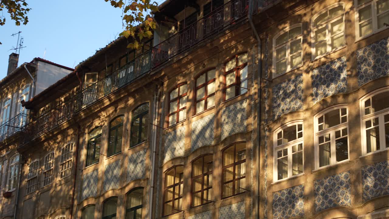 Golden hour glow on traditional Azulejo facades in Porto city centre
