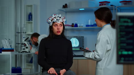 stressed patient sitting on neurological chair with eeg headset