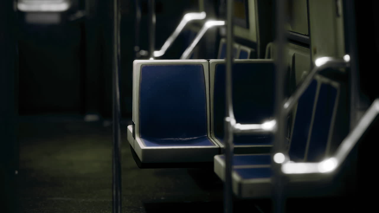 Empty subway train interior with blue seats in quiet moment