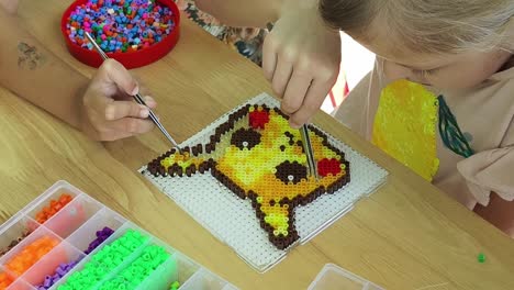 kids beading pikachu pixel art