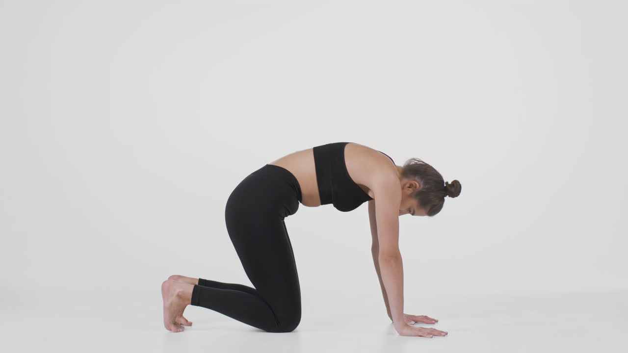 Woman practicing Cow Pose Yoga