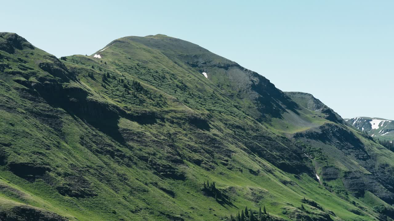 Aerial shot of the side of a mountain in the San Juan mountain range.