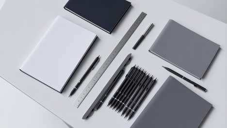 organized workspace with notebooks, pens, and ruler