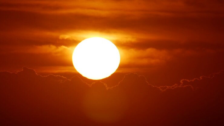 Sunset close up with clouds and sun - timelaps