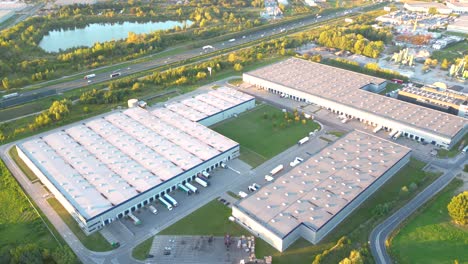 Aerial-view-of-warehouse-storages-or-industrial-factory-or-logistics-center-from-above