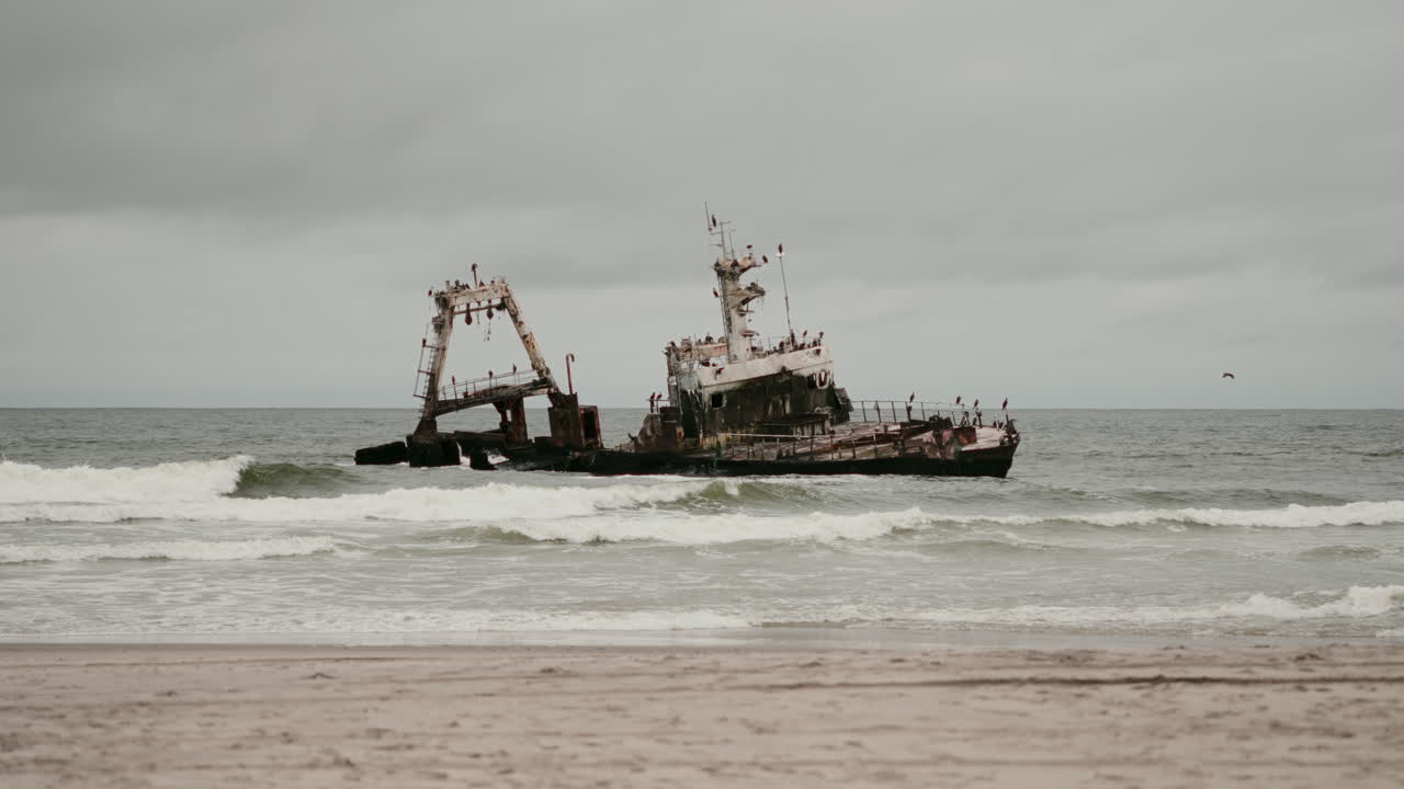 Rusty Shipwreck on a Sandy Beach