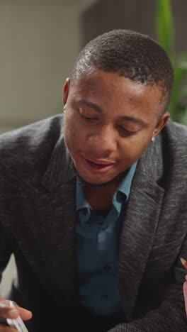 black teacher shows cards and tells object picture names to cute little blonde girl studying english language at home lesson with native speaker slow motion