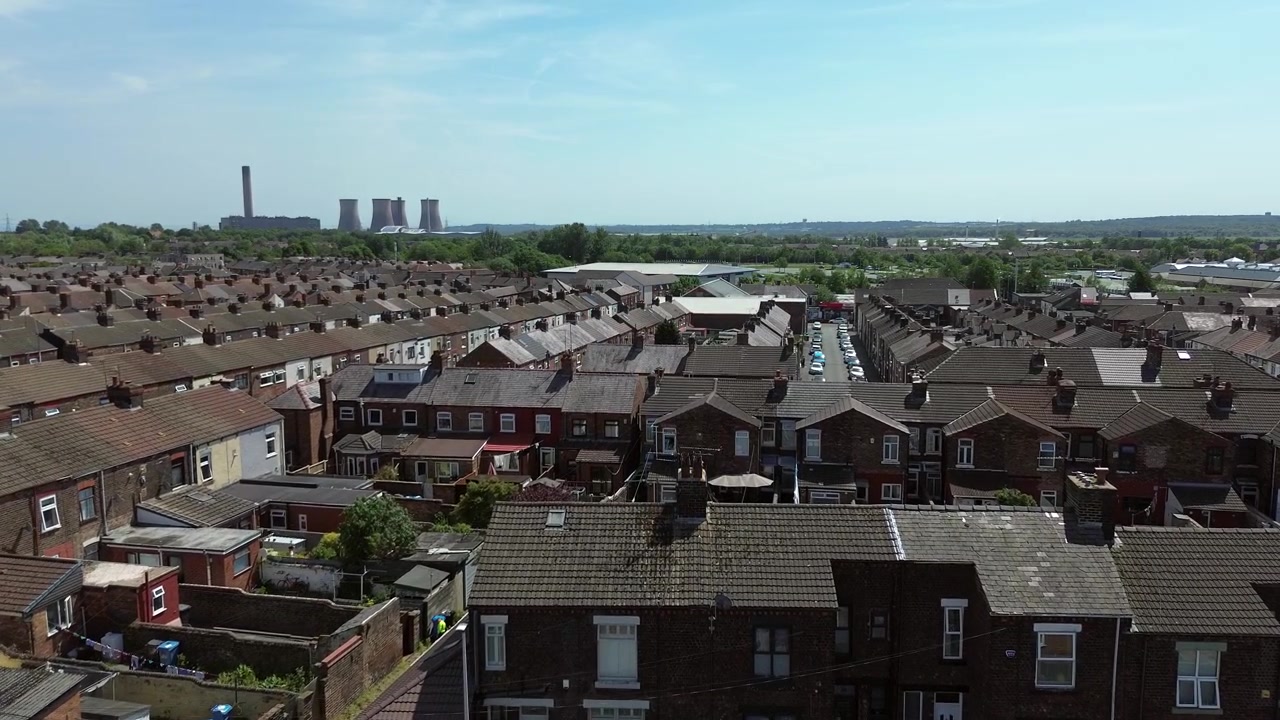 Rows of working class terraced northern town houses aerial view over crowded rundown neighbourhood