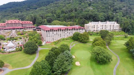 4k drone video of convention center and golf course at grove park inn in asheville, nc on sunny summer day