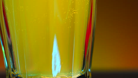 close-up of a glass of carbonated drink