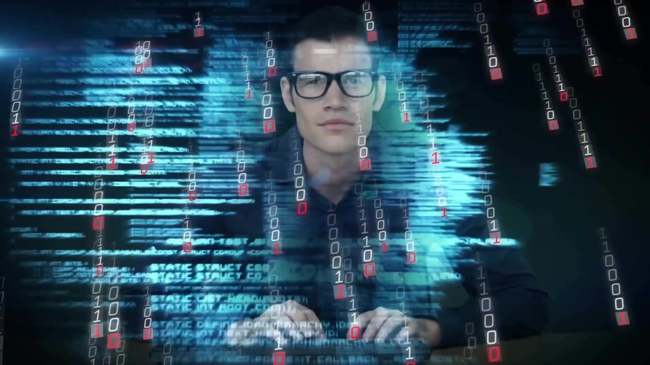 Mann taster på tastatur, initierer et 3D-overlegg mens biter virvler over skjermen for teknisk visualisering.