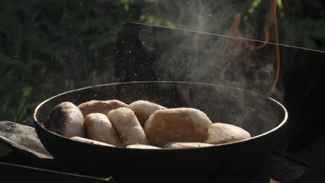 cooking bread in a pan outdoors