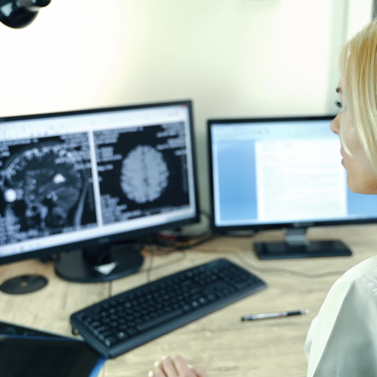 Professional neurologist looking at MRI image of patient's head. Doctor analyzing CT scan to establish diagnosis