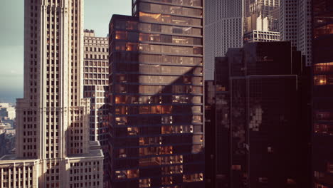 urban skyline featuring modern buildings at dusk with city lights illuminating