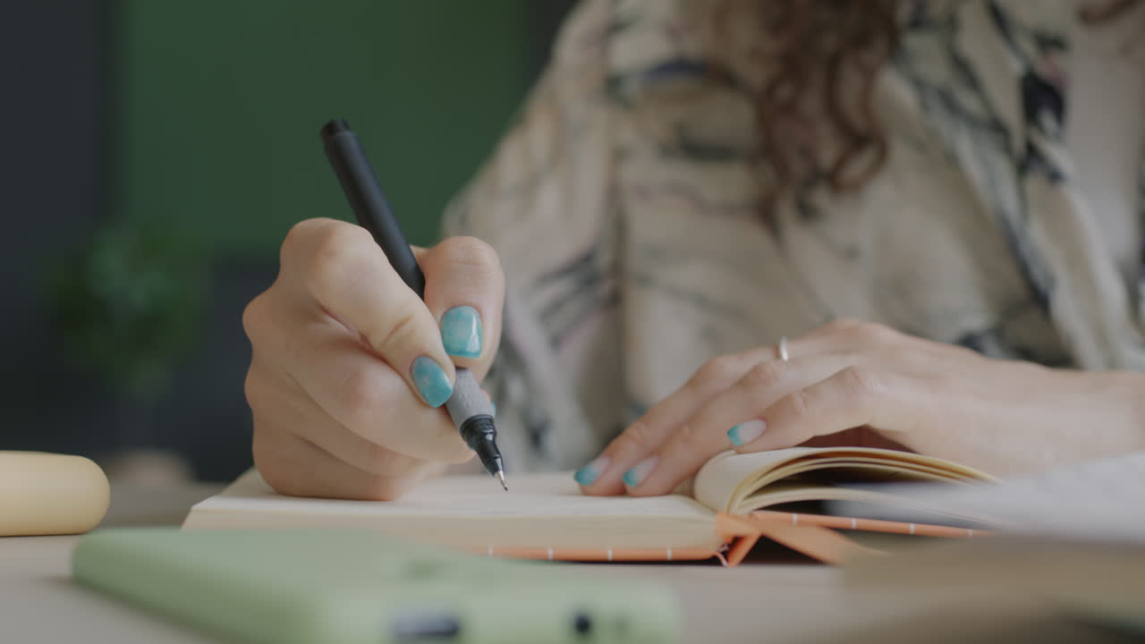 Woman Writing in a Notebook