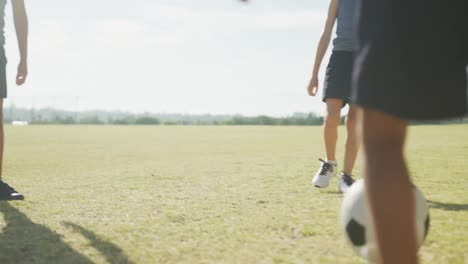 video of legs of diverse boys playing soccer on sports field