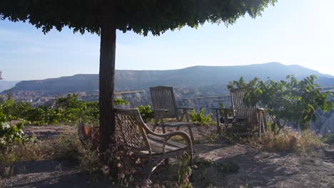 Chairs-on-a-scenic-overlook-at-valley-in-Cappadocia-Uchisar,-Turkey