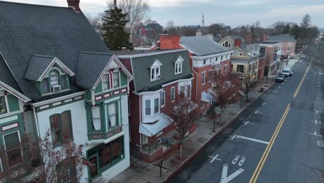 aerial establishing shot of old suburban homes in winter