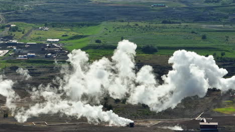 geothermal active zone with the steaming ground, geothermal power plant, aerial