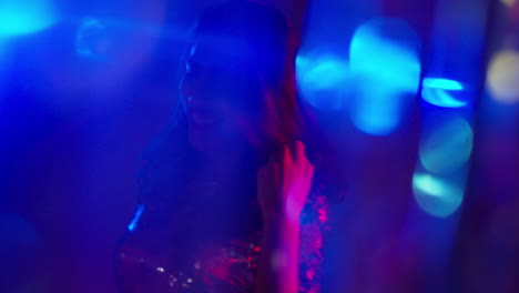 Close-Up-Of-Woman-In-Nightclub-Bar-Or-Disco-Dancing-With-Sparkling-Lights-4