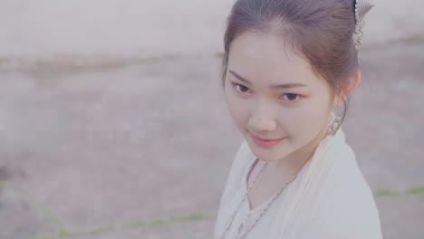 Beautiful Asian Girl In Lao Traditional Costume Smiling And Looking At Camera, Slow Motion