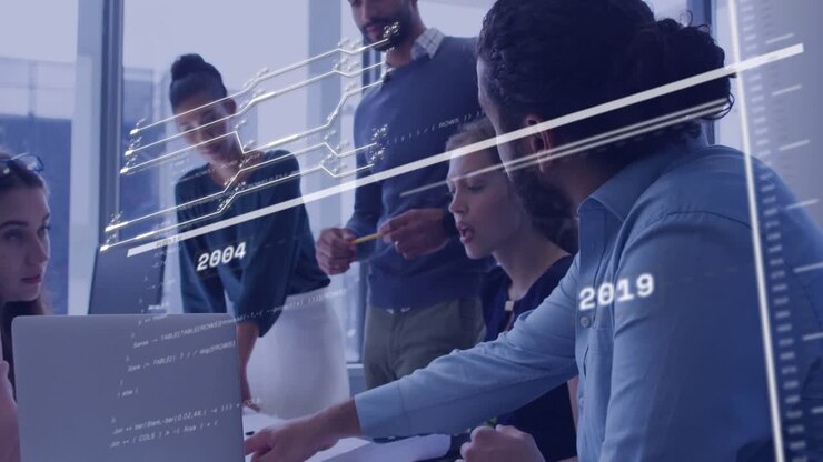 Seated woman scrolling laptop while team pointing, causing animated timeline for business review