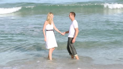 Man-and-woman-playing-in-the-sea