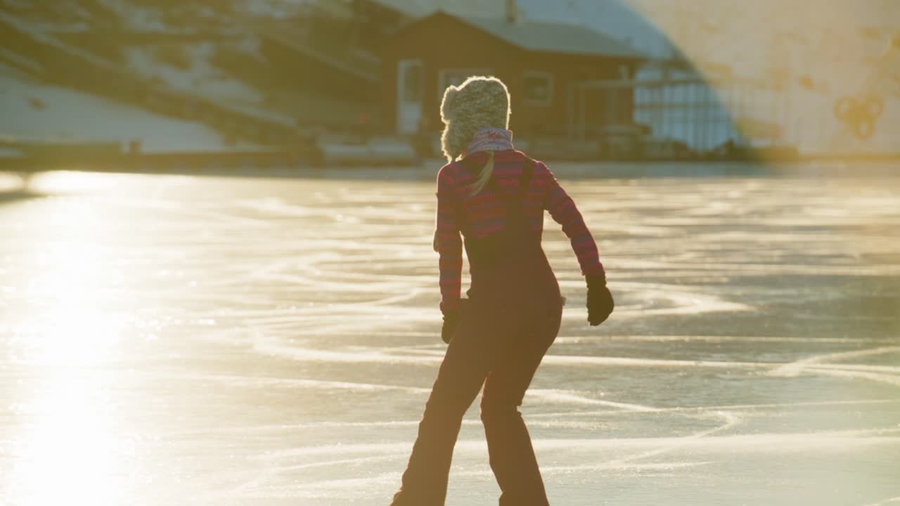 A Serene Ice Skating Experience Captured in Golden Light: A Solo Skater Gliding Gracefully Across a Frozen Surface, Embracing the Beauty of Winter While Enjoying the Tranquility of Nature's Wonderland