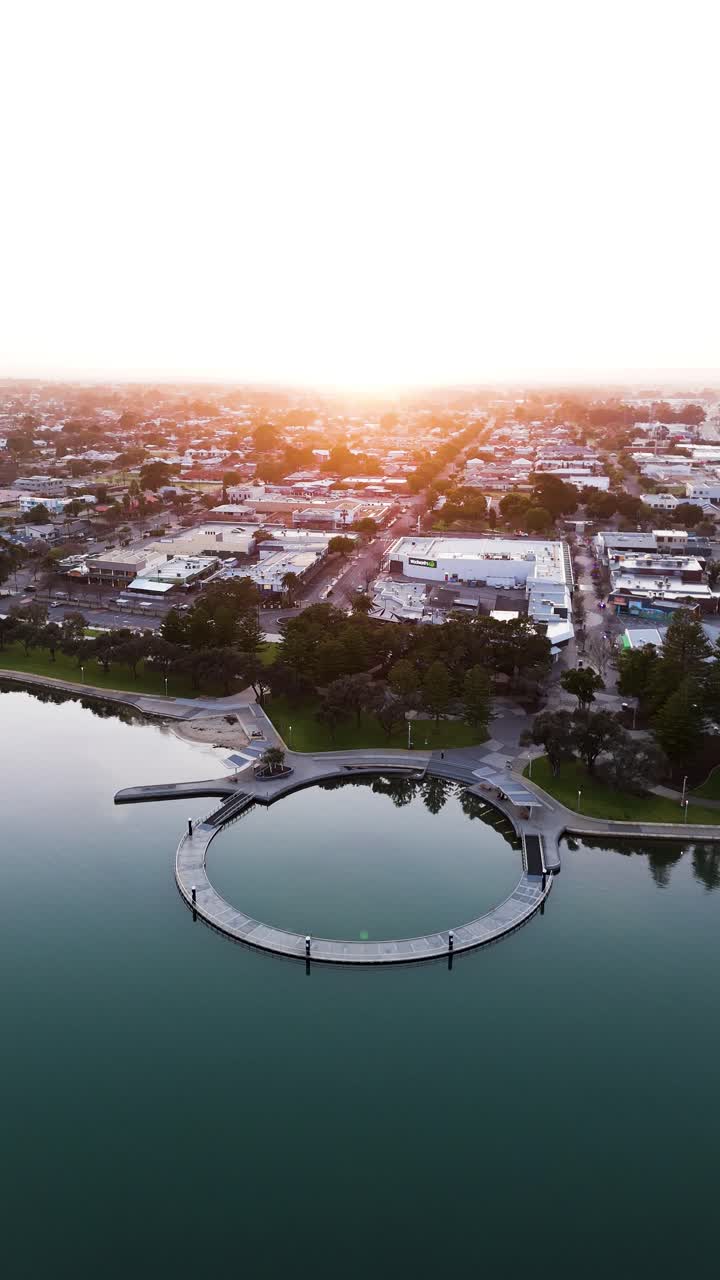 Mandurah foreshore at sunrise, vertical orbiting drone shot