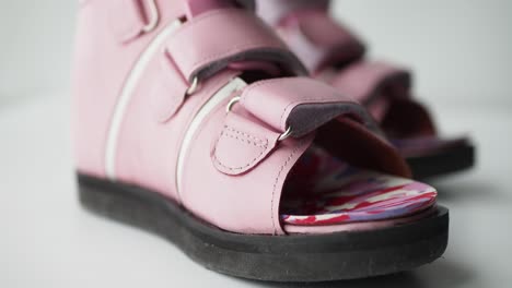 pink children's orthotic shoes