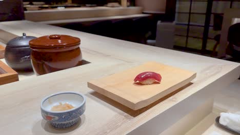 chopsticks picking sushi at a japanese restaurant