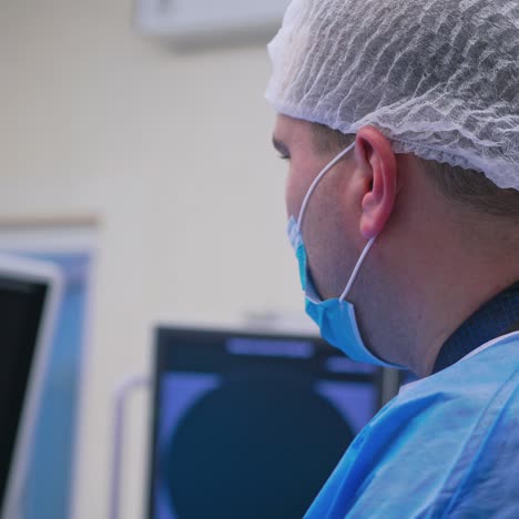 professional doctors in medical uniform making an operation. medical procedure in emergency room.