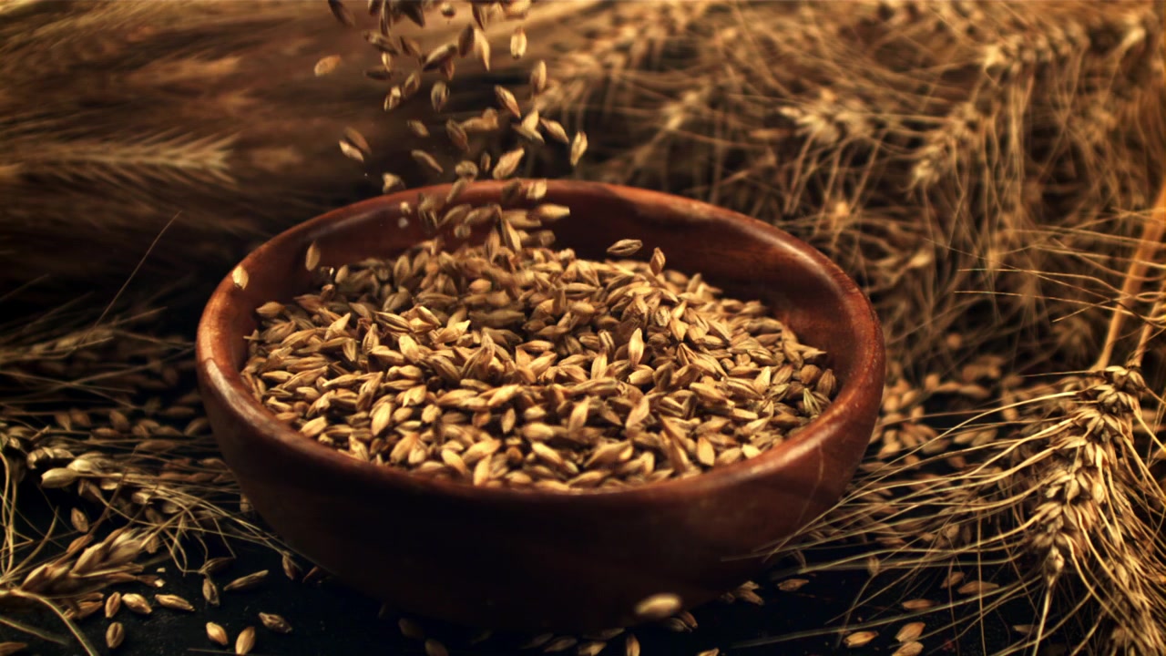 Slow Motion of Wheat Grains Falling into a Wooden Bowl