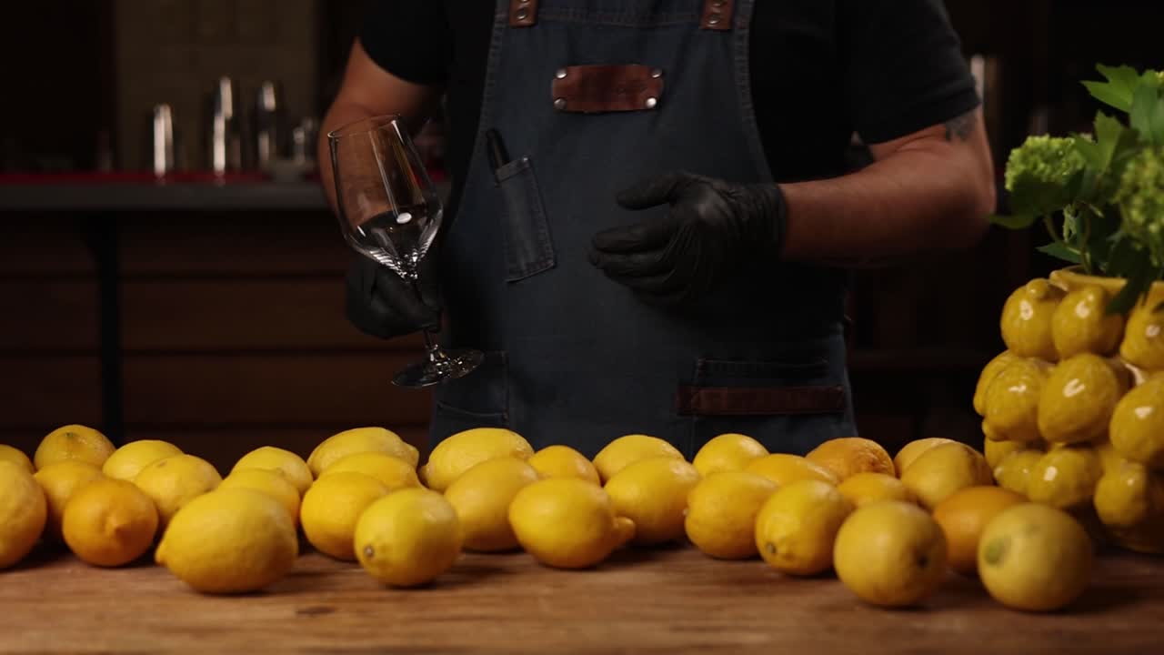 Bartender Preparing Drinks with Lemons
