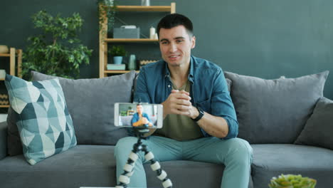 man conducting a video call from his living room