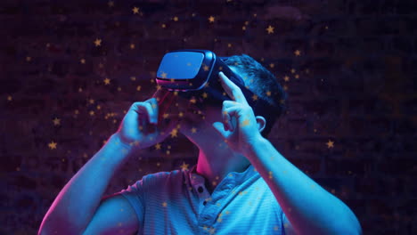 Wearing virtual reality headset, person in dark room with glowing stars animation