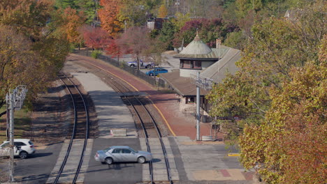 cars cross train tracks at the kirkwood train station in st