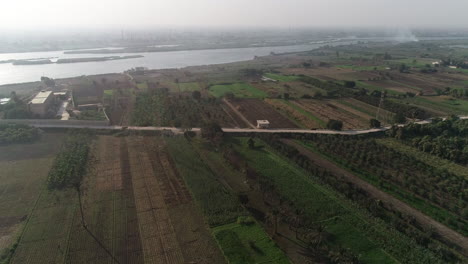 Aerial-Drone-shot-for-The-River-Nile-of-Egypt-surrounded-by-the-green-lands-of-the-Nile-Valley