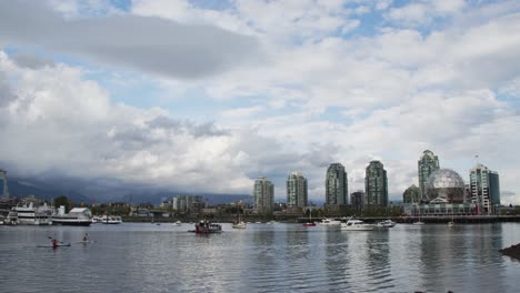 false creek cityscape with science world and buildings, vancouver canada