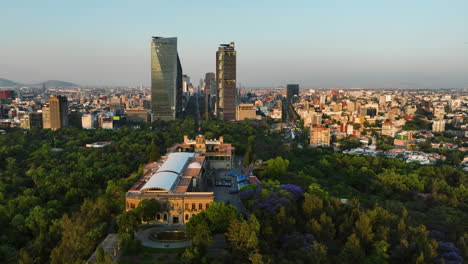 aerial tracking shot of the chapultapec castle and reforma skyscrapers in cdmx