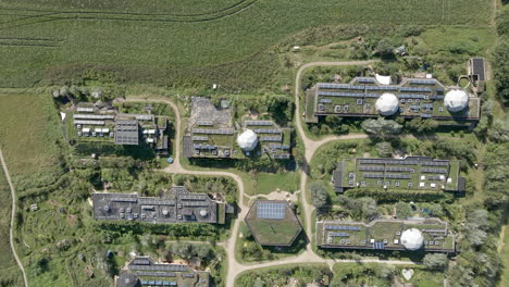 High-top-down-aerial-of-beautiful-green-earthship-village